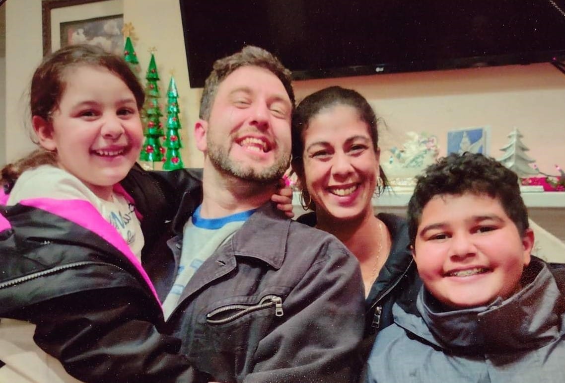 Warehouse worker with his family